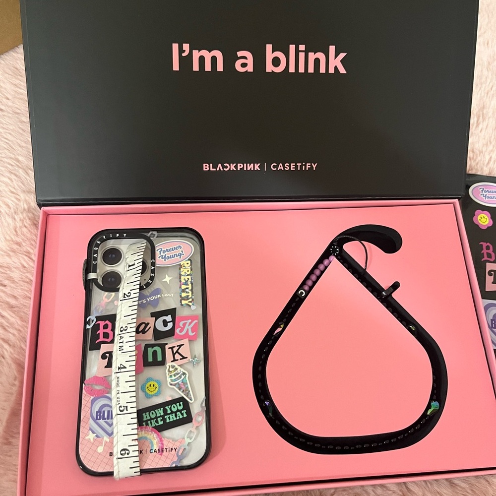 Black Pink phone case and string to connect on phone.